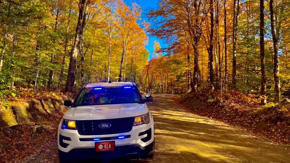 Autumn picture of a cruiser on a dirt road